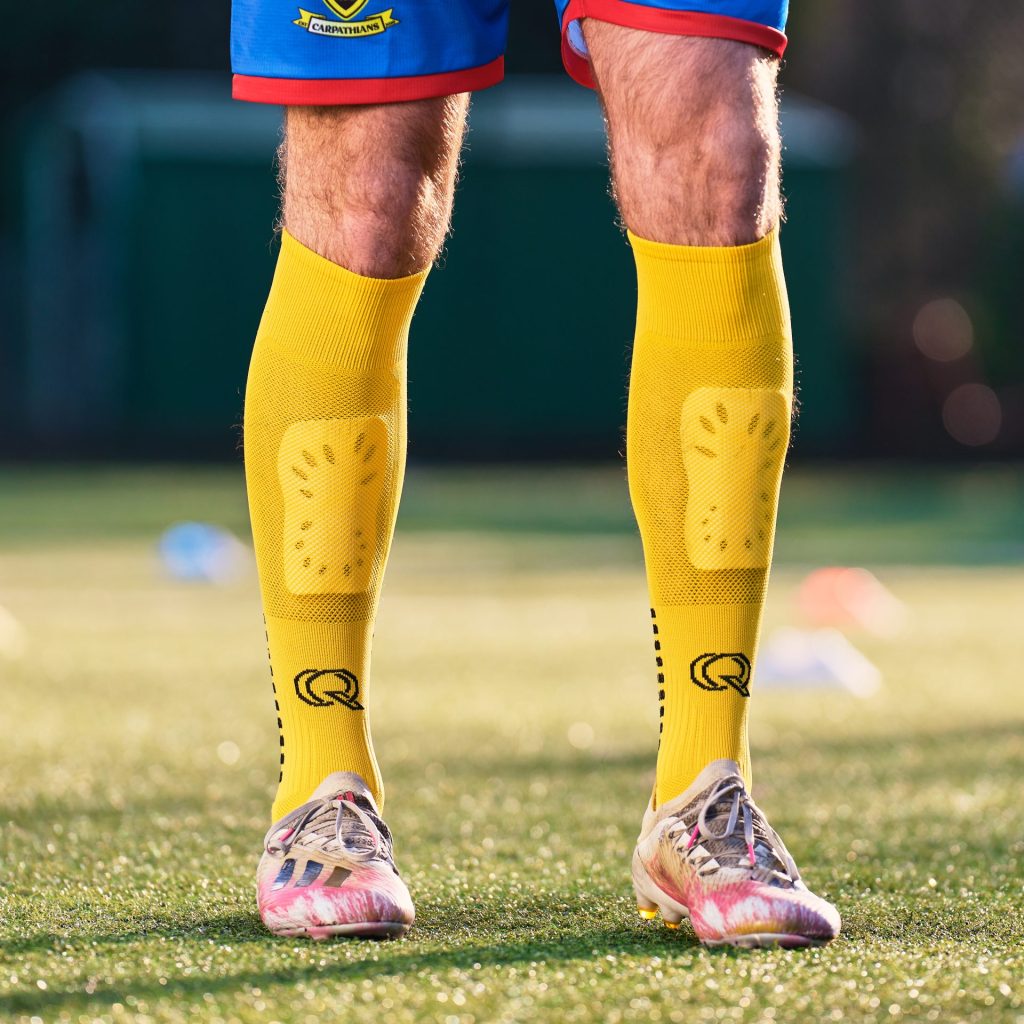 man wearing qusoq football grip socks